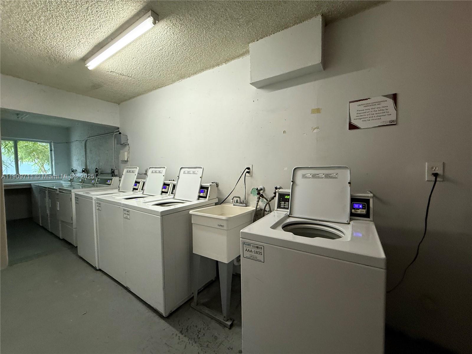 2920 Southwest 28th Terrace, Unit 302 Miami, FL 33133 - Photo 12 of 14 a room with storage and utility