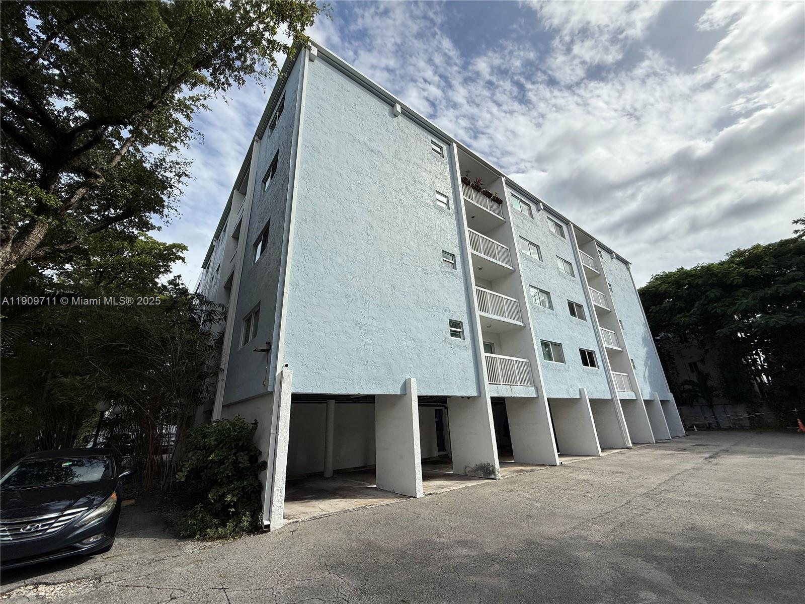 2920 Southwest 28th Terrace, Unit 302 Miami, FL 33133 - Photo 14 of 14 a view of building with yard