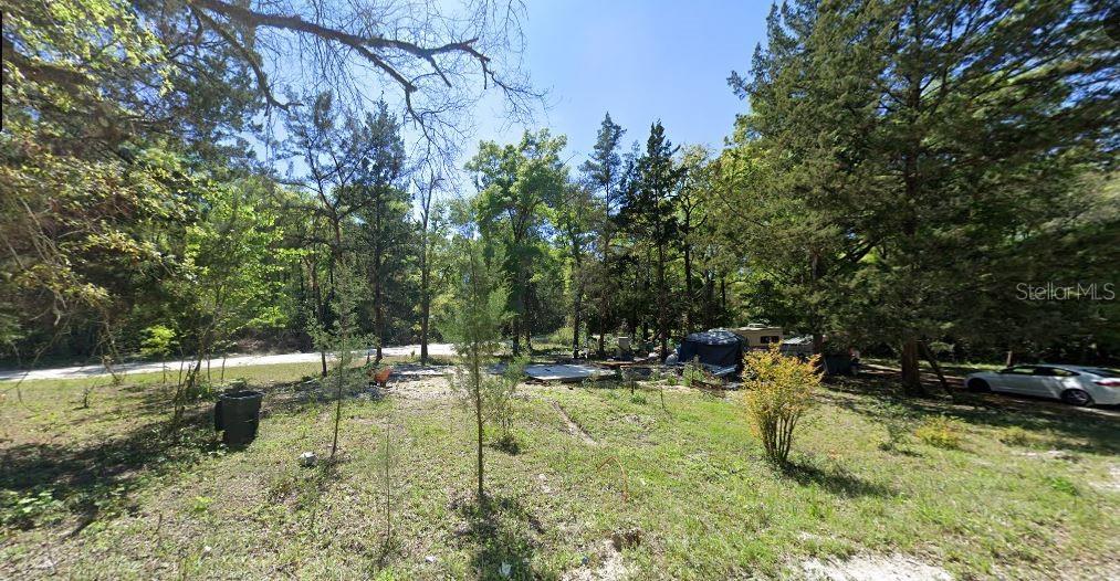 8089 Southwest 80th Trail Trenton, FL 32693 - Photo 2 of 7 a view of swimming pool with a yard