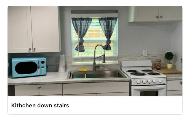 a kitchen with a stove and a microwave