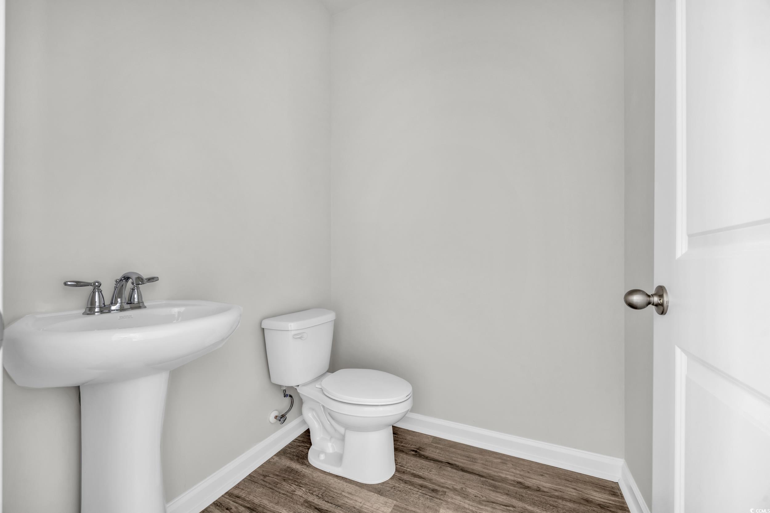 545 Goldstar Street Conway, SC 29526 - Photo 14 of 37 Bathroom featuring sink, hardwood / wood-style flo