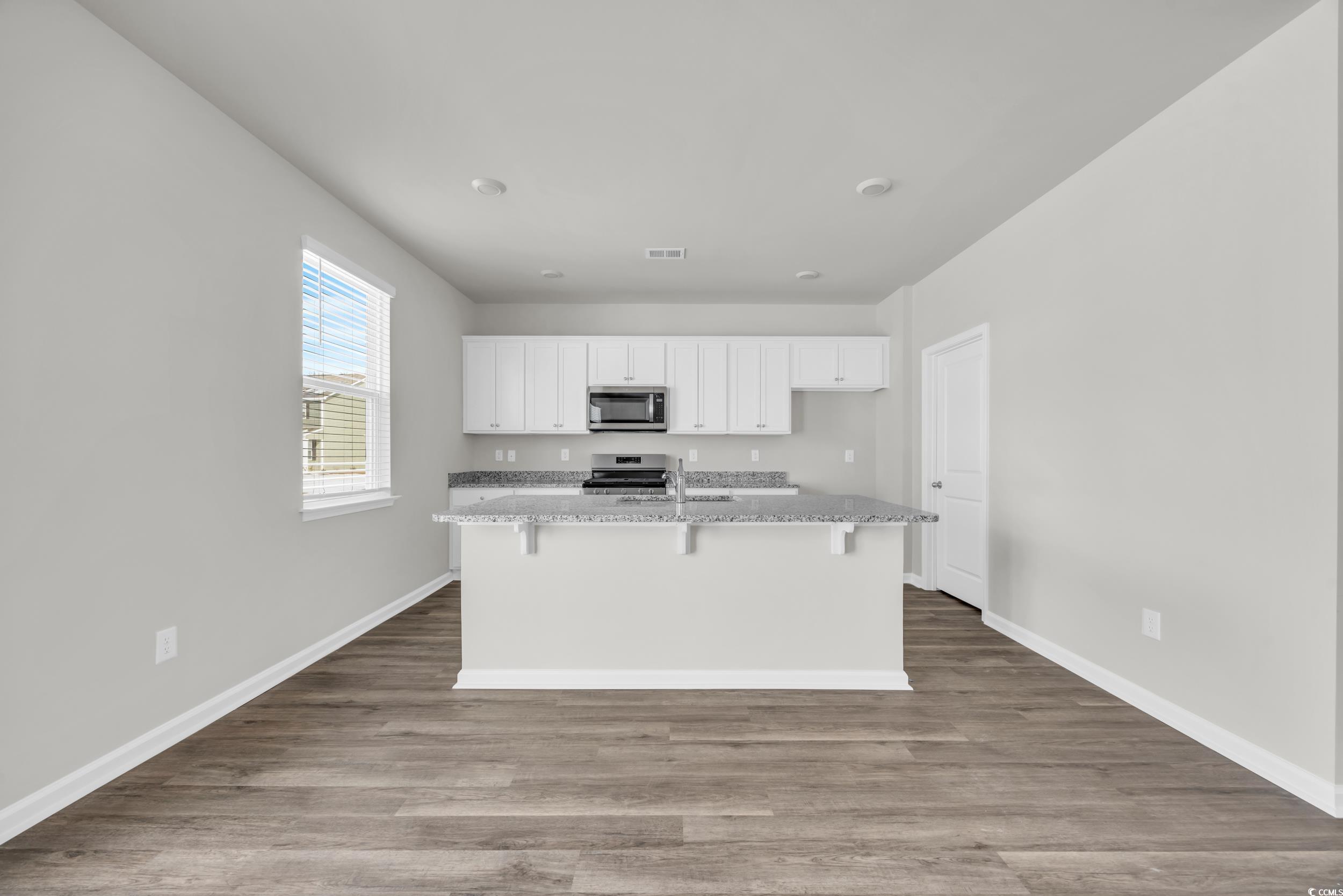545 Goldstar Street Conway, SC 29526 - Photo 15 of 37 Kitchen featuring a center island with sink, appli
