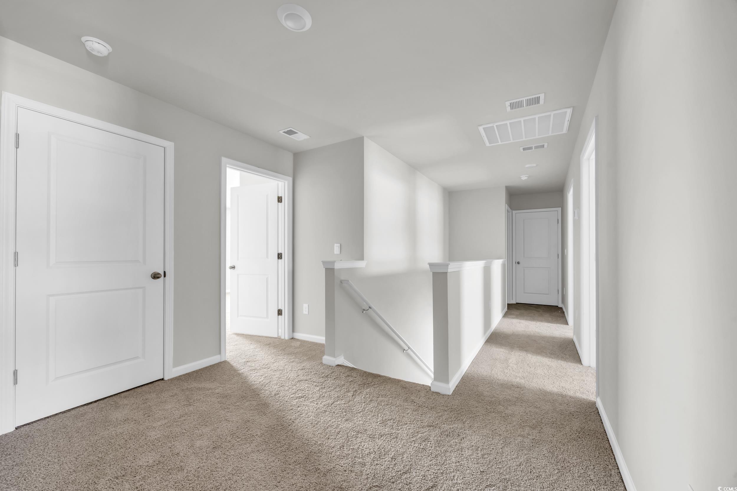 545 Goldstar Street Conway, SC 29526 - Photo 25 of 37 Hallway featuring light carpet
