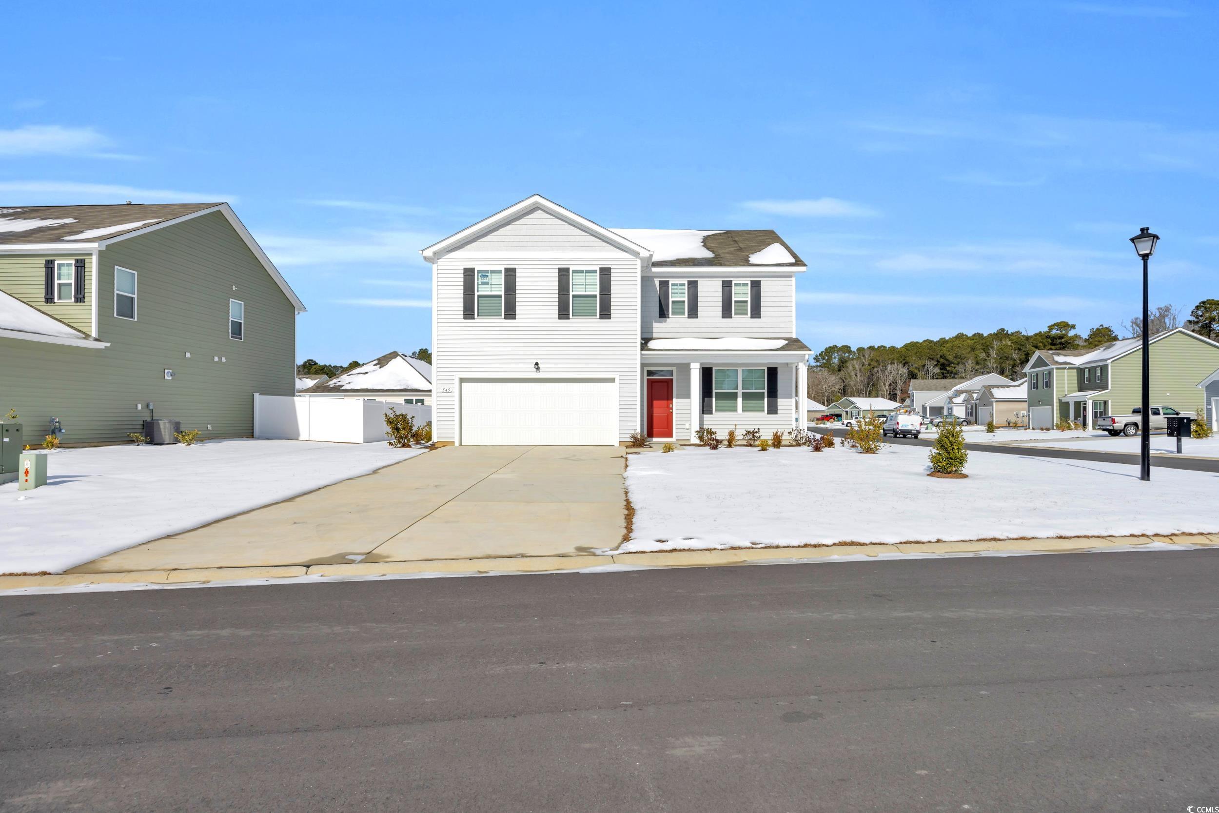 545 Goldstar Street Conway, SC 29526 - Photo 4 of 37 View of front facade with a garage and central AC
