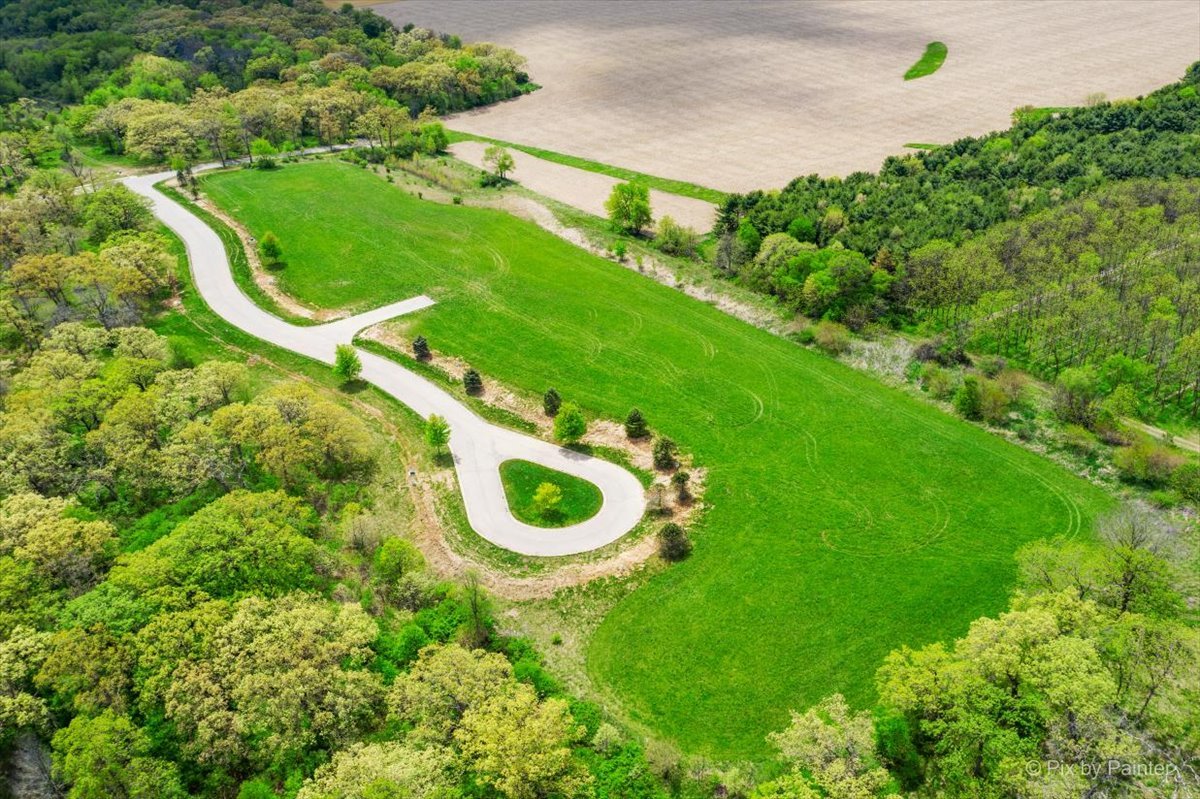 4210 Riverside Drive Johnsburg, IL 60051 - Photo 22 of 29 a view of a backyard with table and chairs