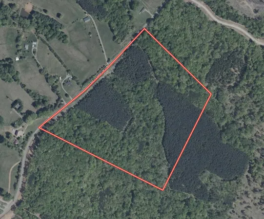 a view of a lush green hillside and a building