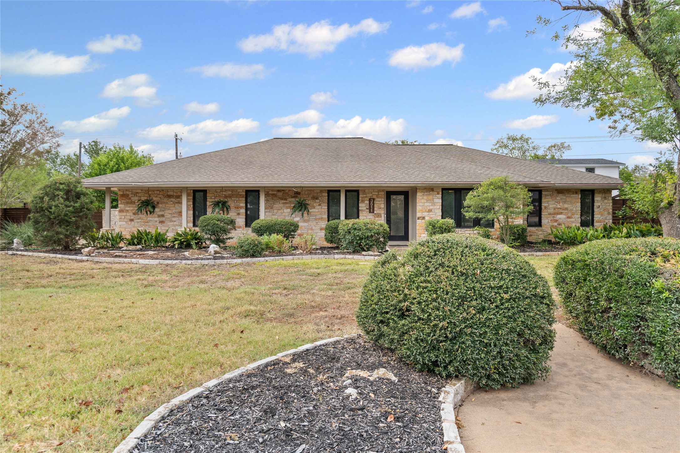 3511 Eldorado Trail Austin, TX 78739 - Photo 1 of 40 a front view of a house with garden