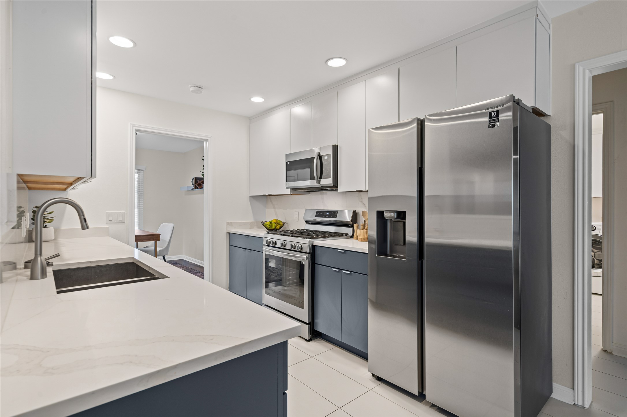 3511 Eldorado Trail Austin, TX 78739 - Photo 16 of 40 Quartz countertops and stainless steel appliances