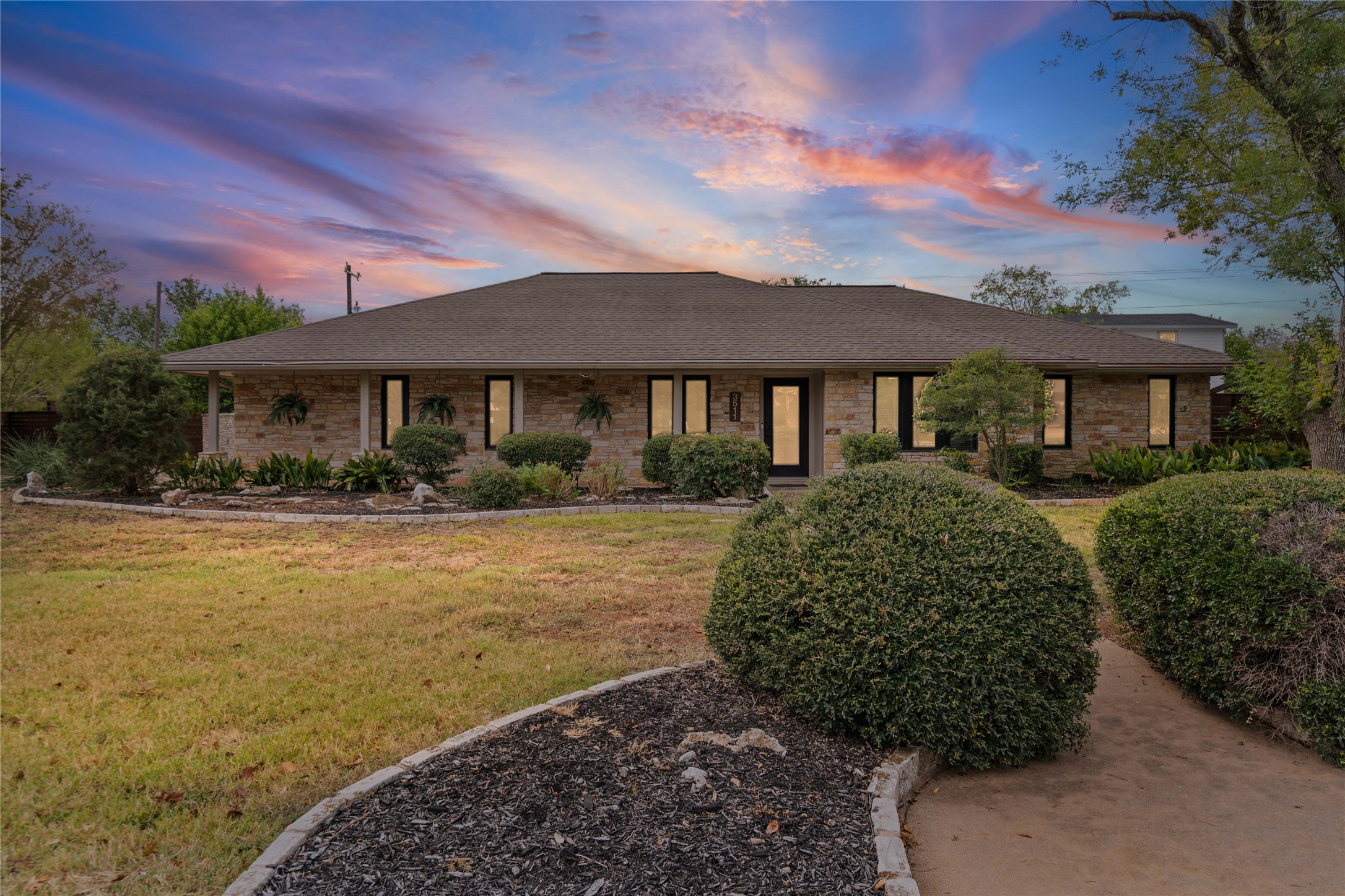 3511 Eldorado Trail Austin, TX 78739 - Photo 7 of 40 a front view of a house with a yard