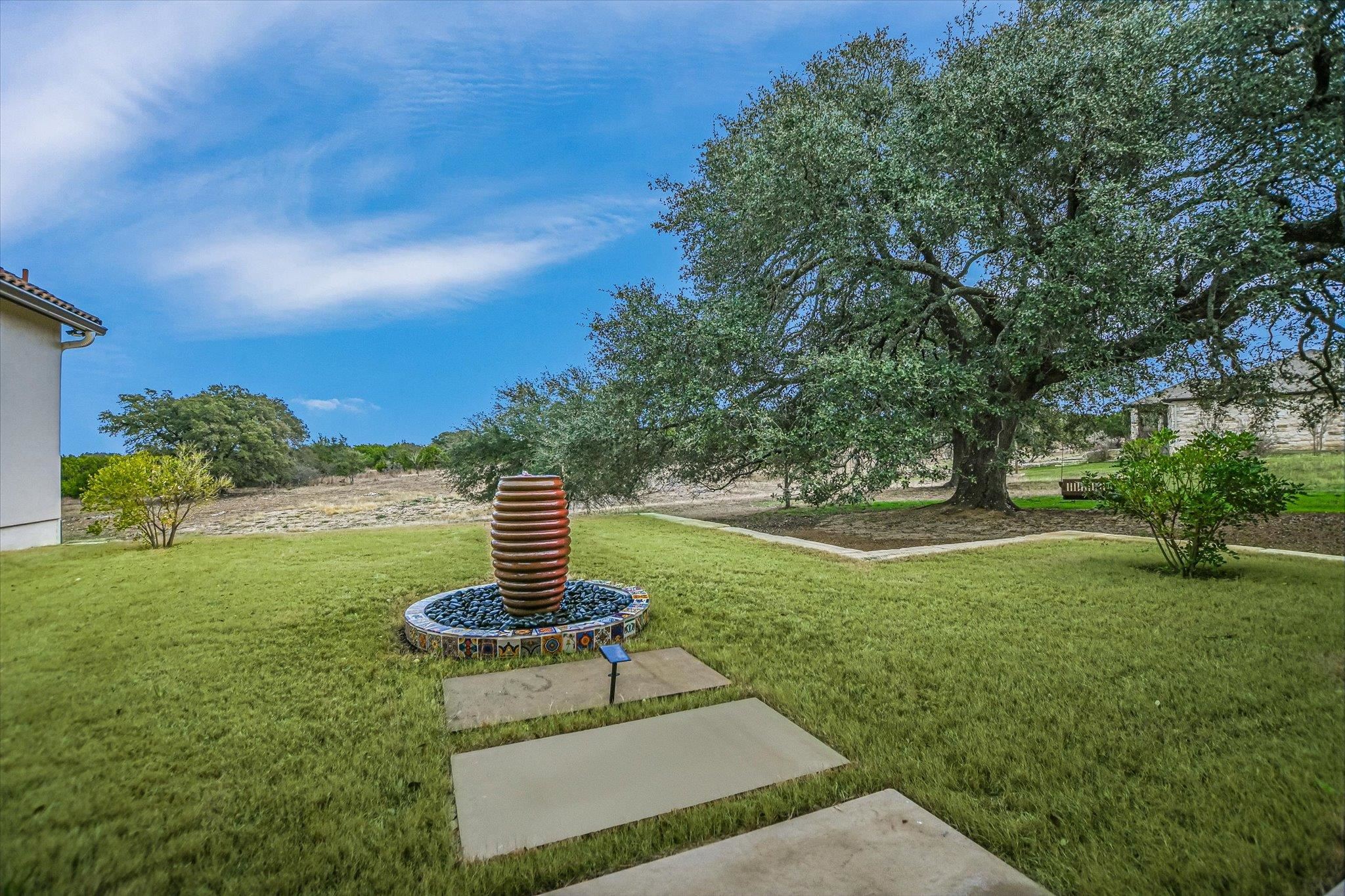 401 Eagle Ridge Burnet, TX 78611 - Photo 11 of 30 a garden view with a fountain