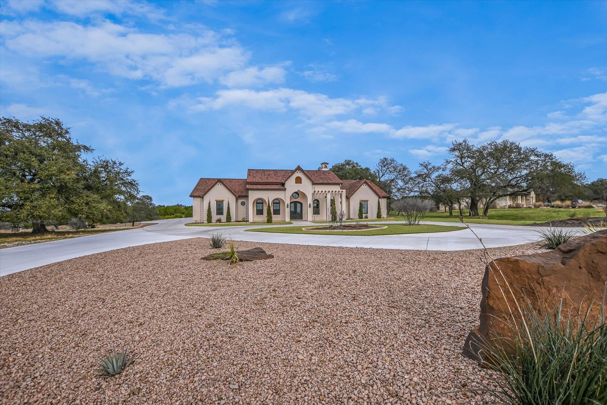 401 Eagle Ridge Burnet, TX 78611 - Photo 26 of 30 a yellow and red house with a yard