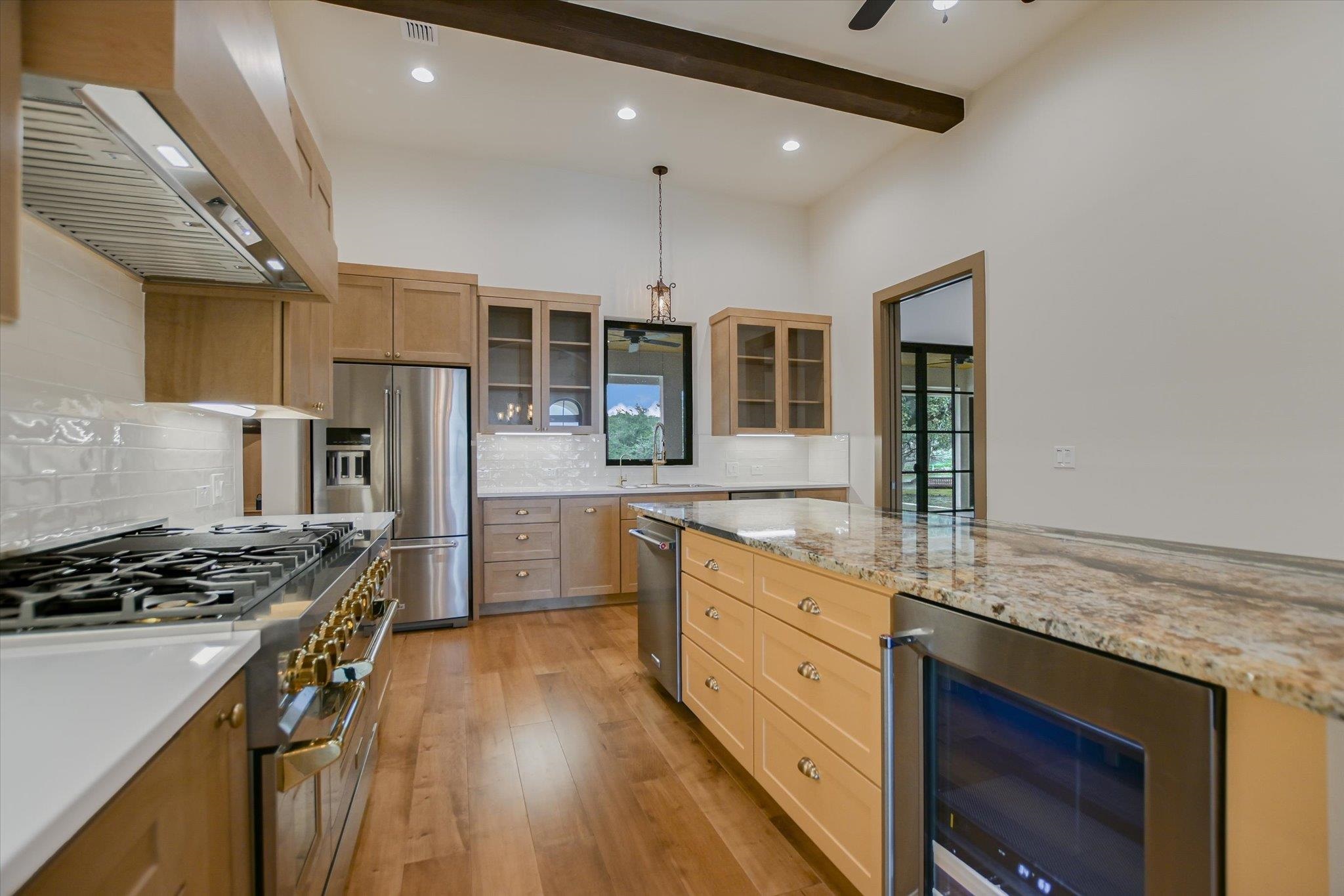 401 Eagle Ridge Burnet, TX 78611 - Photo 7 of 30 a kitchen with stainless steel appliances granite countertop a stove and a refrigerator