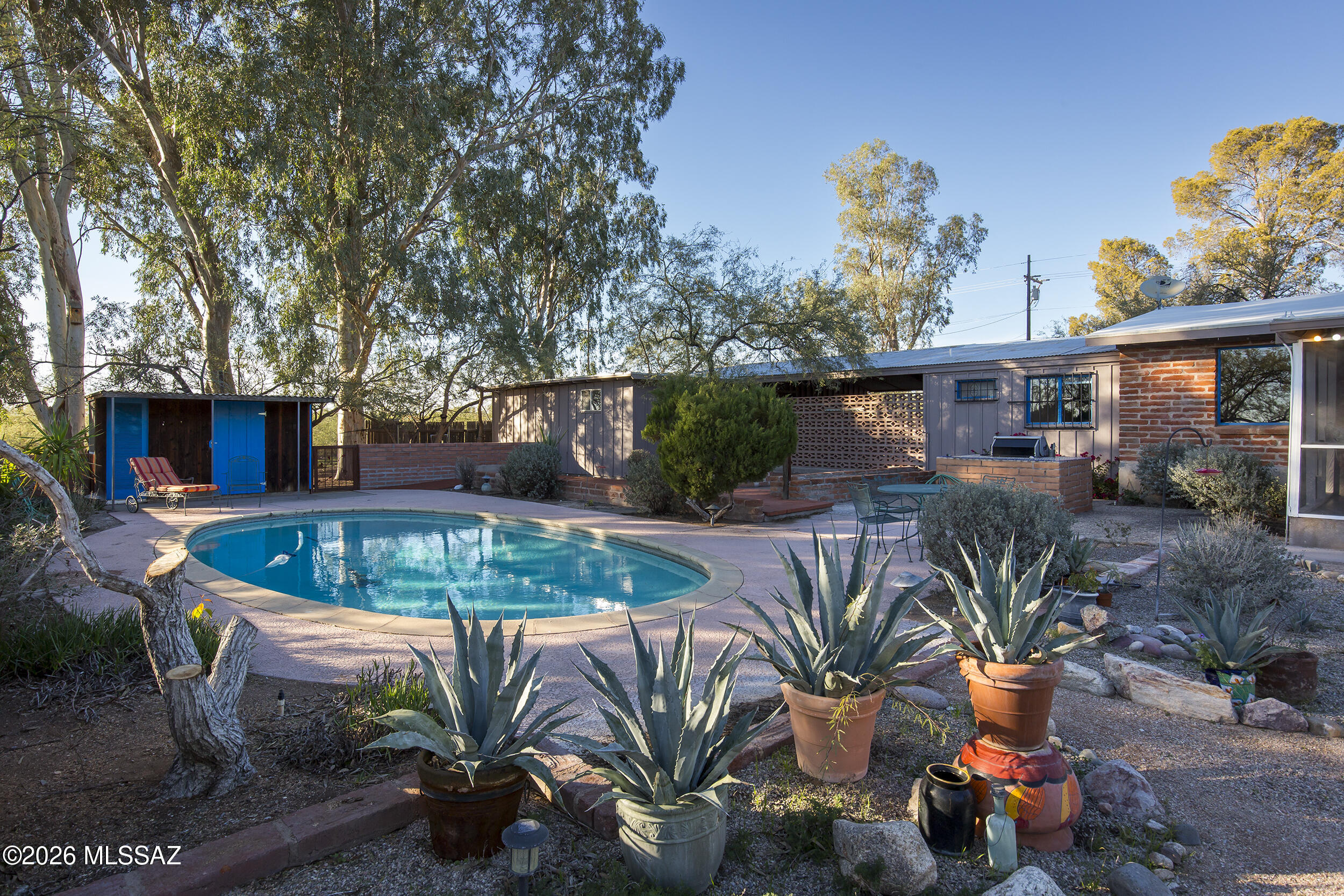 4130 East River Road Tucson, AZ 85718 - Photo 30 of 46 a view of a backyard with swimming pool and furniture