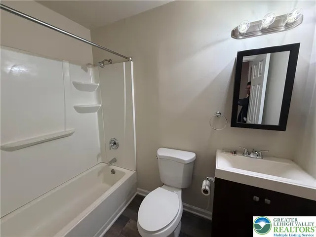 a bathroom with a toilet sink shower and bathtub