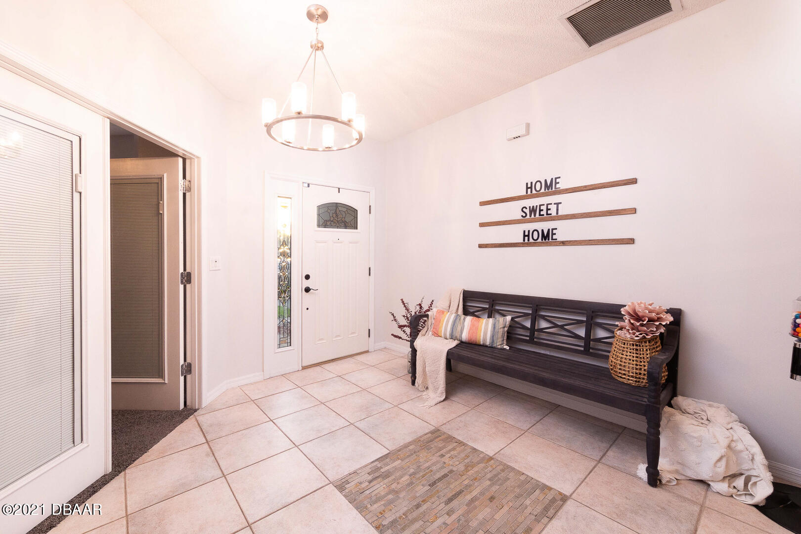 6166 Del Rio Drive Port Orange, FL 32127 - Photo 12 of 53 a view of dining room with furniture and chandelier
