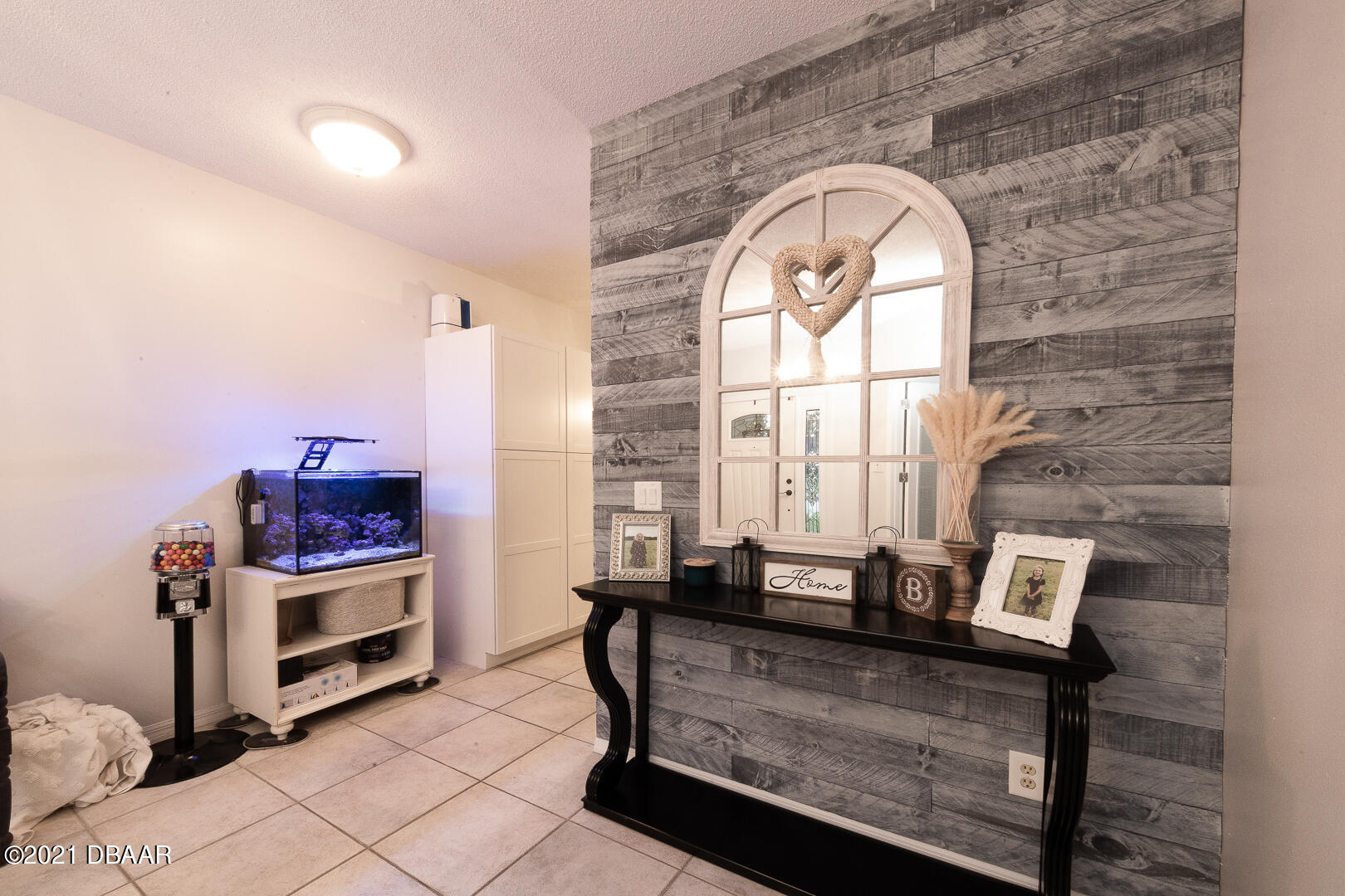 6166 Del Rio Drive Port Orange, FL 32127 - Photo 15 of 53 a living room with furniture a fireplace and a flat screen tv