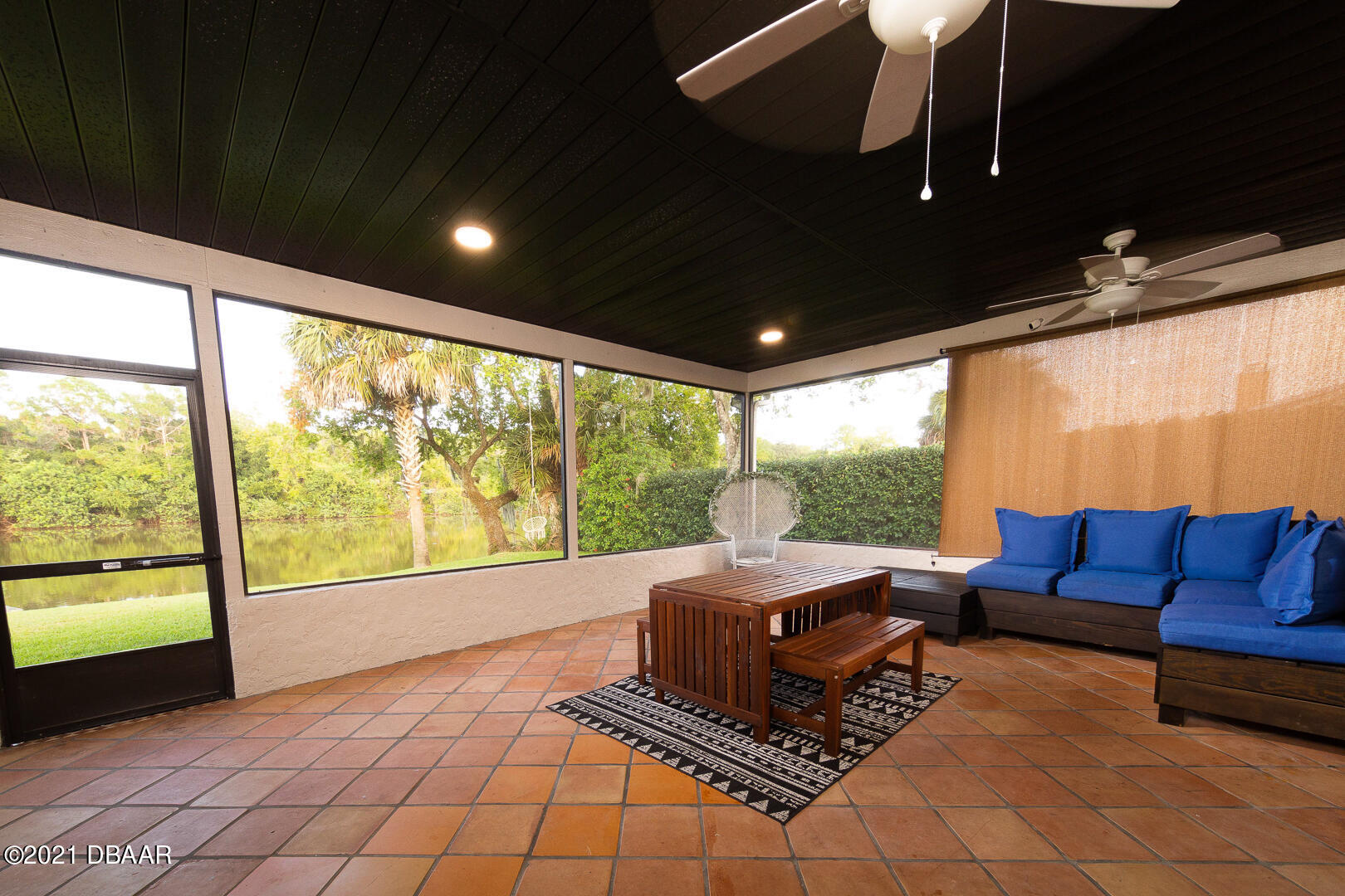 6166 Del Rio Drive Port Orange, FL 32127 - Photo 16 of 53 a living room with furniture and a floor to ceiling window
