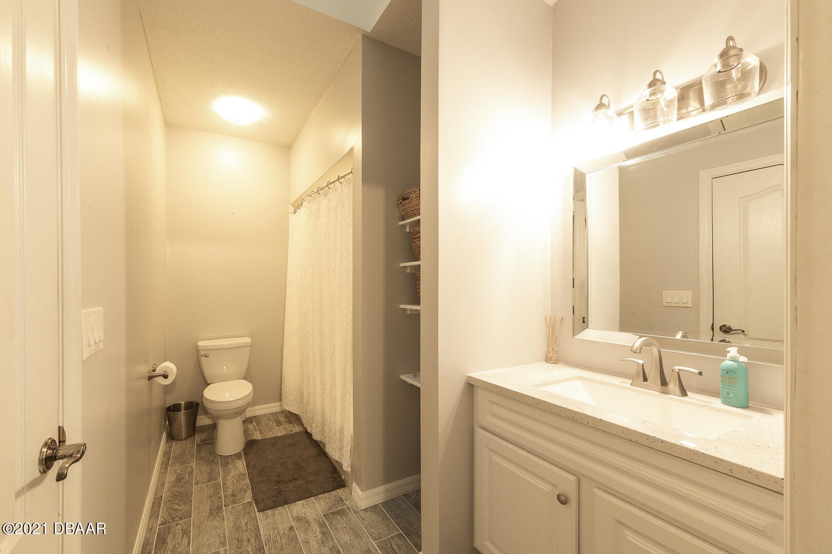 6166 Del Rio Drive Port Orange, FL 32127 - Photo 20 of 53 a bathroom with a sink and a mirror