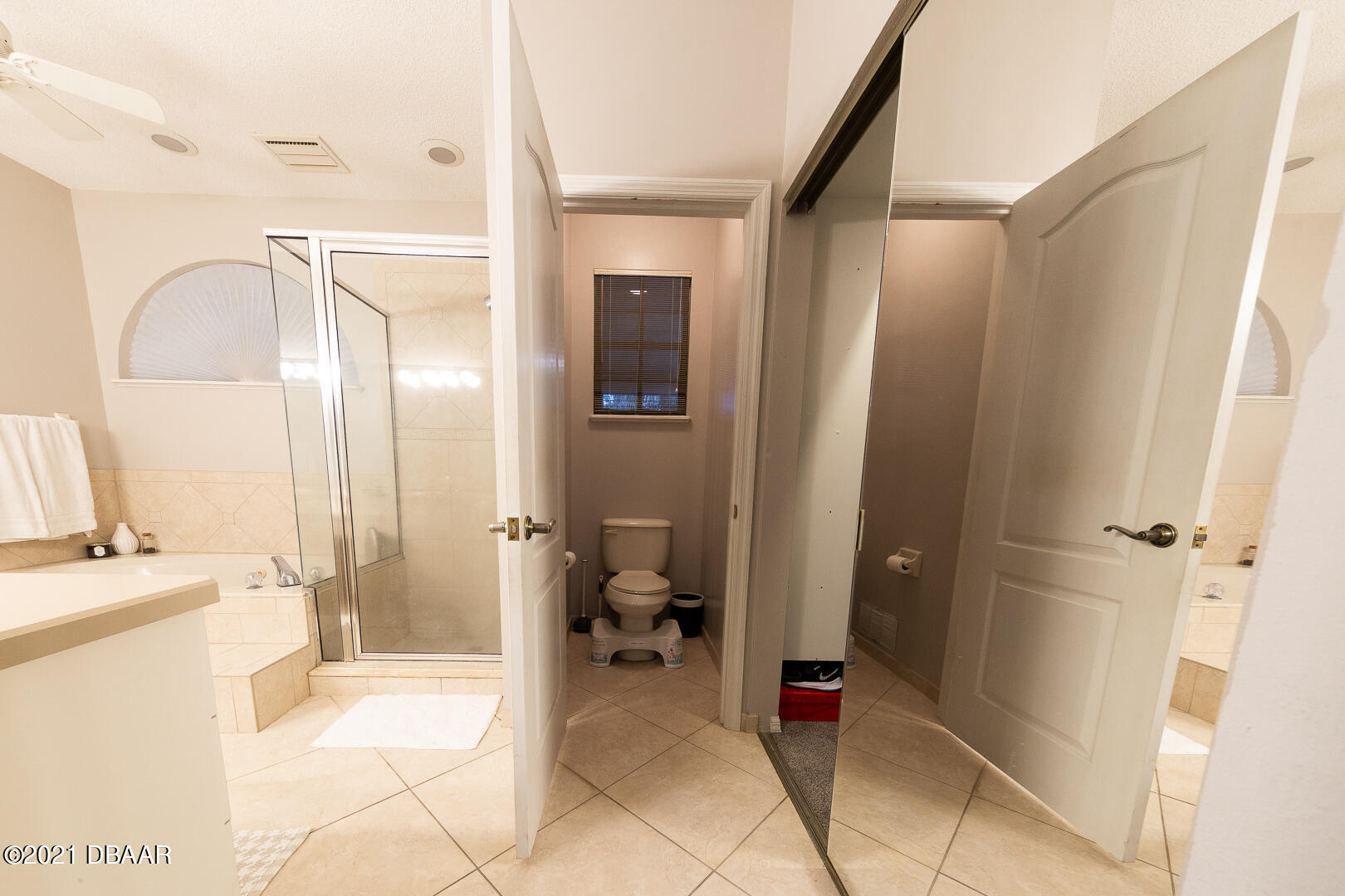 6166 Del Rio Drive Port Orange, FL 32127 - Photo 27 of 53 a bathroom with a tub and a glass door shower