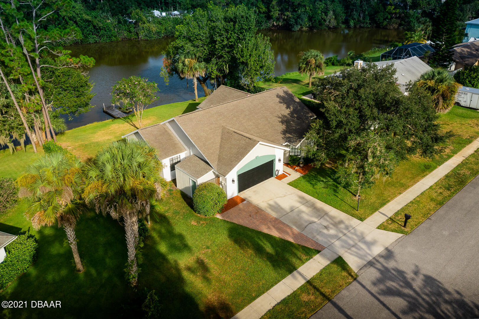 6166 Del Rio Drive Port Orange, FL 32127 - Photo 30 of 53 an aerial view of residential house with outdoor space and lake view