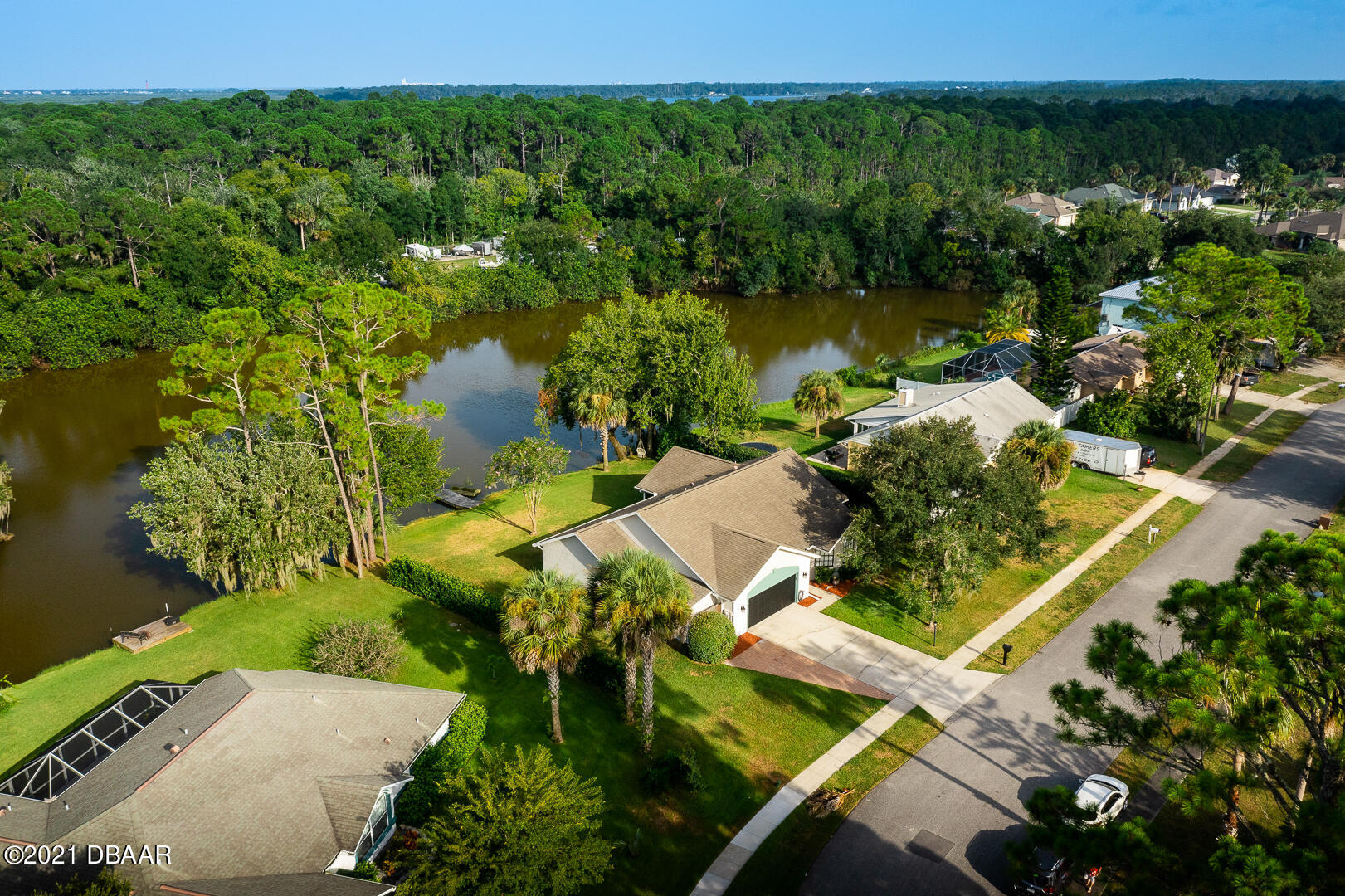 6166 Del Rio Drive Port Orange, FL 32127 - Photo 3 of 53 an aerial view of a house with a yard lake view and mountain view