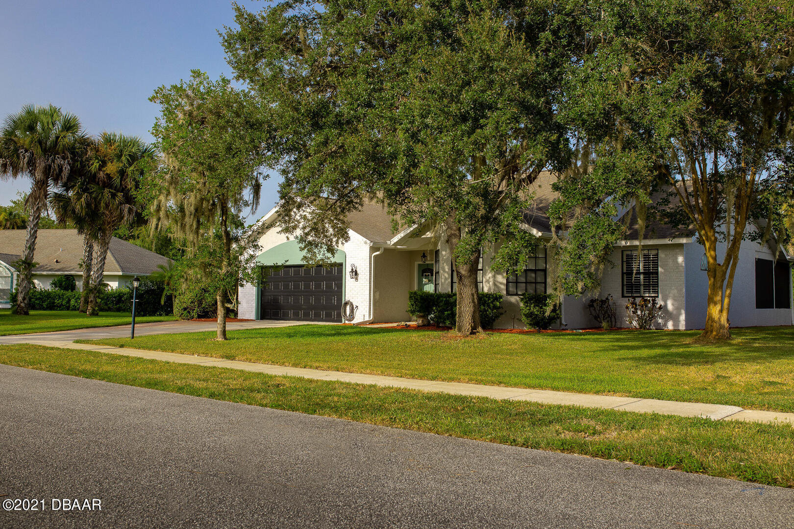 6166 Del Rio Drive Port Orange, FL 32127 - Photo 37 of 53 a view of a house with a big yard and large trees