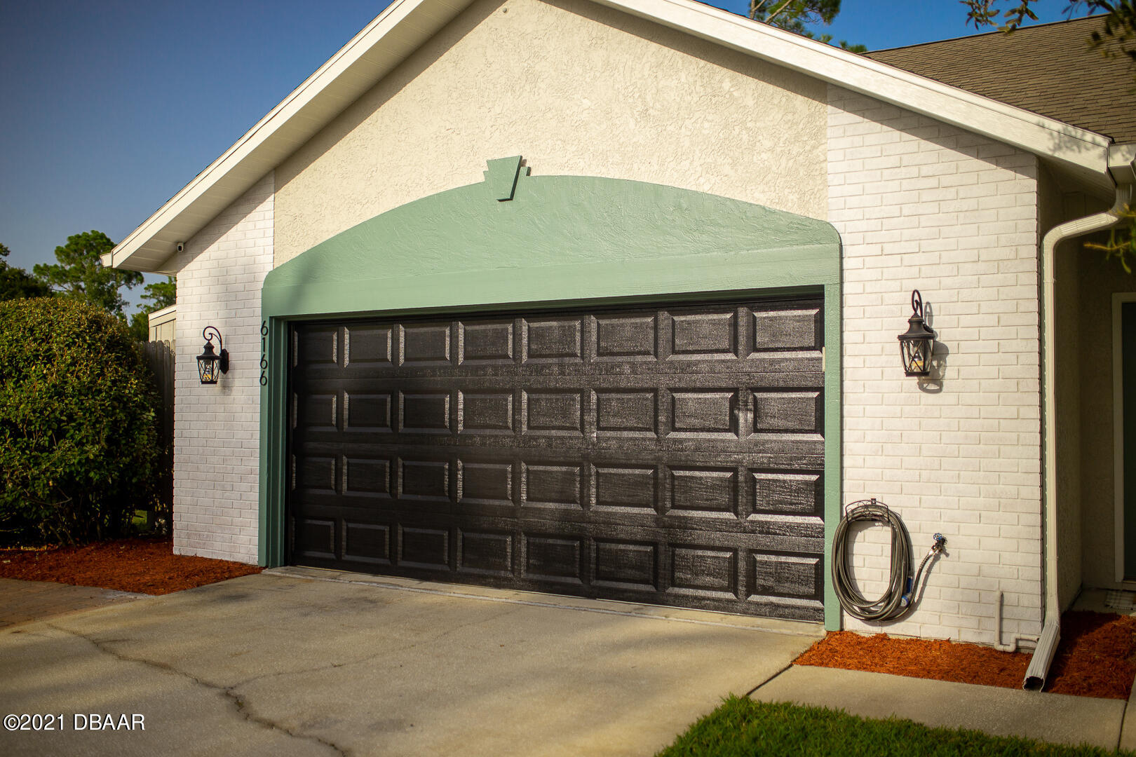 6166 Del Rio Drive Port Orange, FL 32127 - Photo 45 of 53 a front view of a house with garden