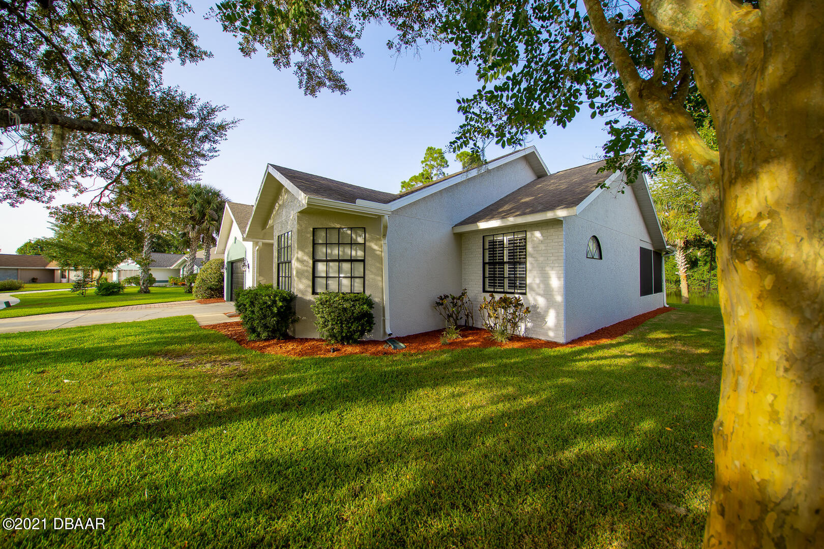6166 Del Rio Drive Port Orange, FL 32127 - Photo 46 of 53 a front view of a house with a yard