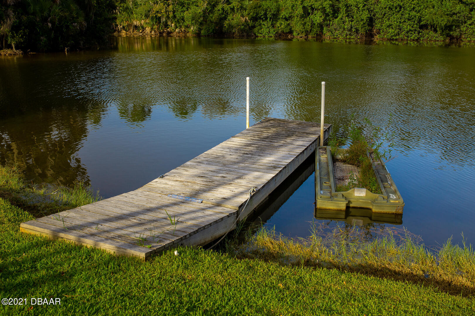 6166 Del Rio Drive Port Orange, FL 32127 - Photo 48 of 53 a view of a lake with a house