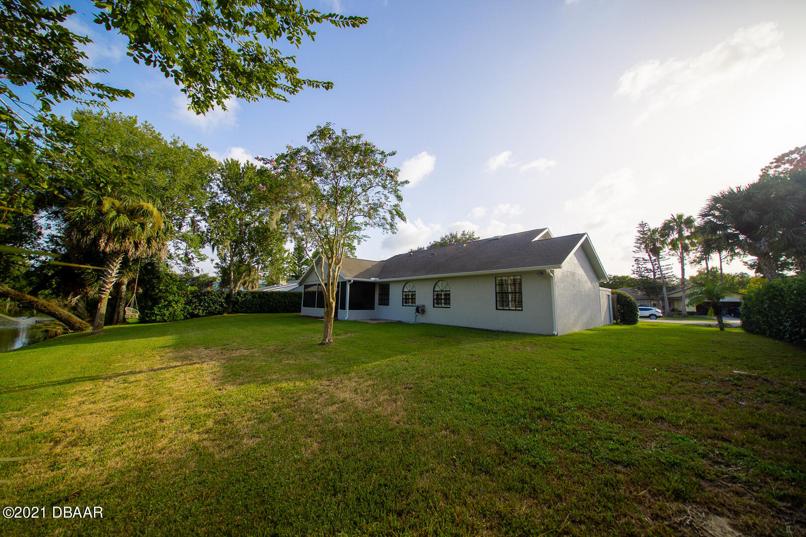 6166 Del Rio Drive Port Orange, FL 32127 - Photo 53 of 53 a view of a house with a big yard and large trees