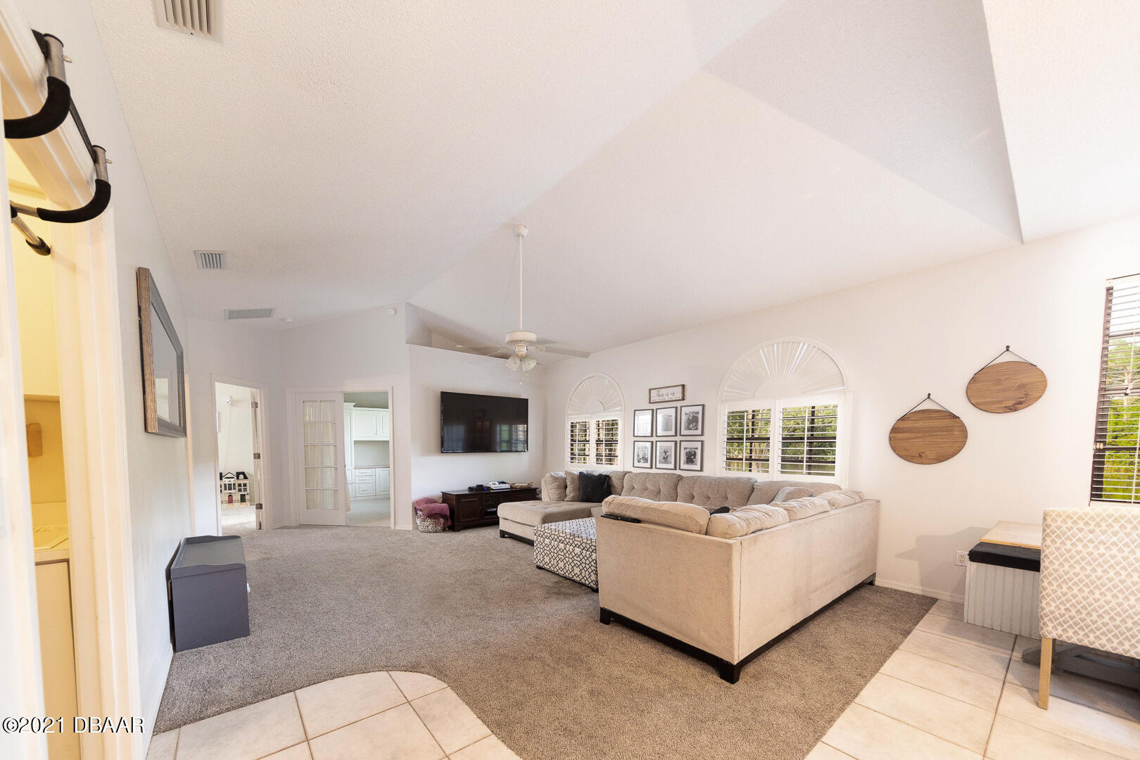 6166 Del Rio Drive Port Orange, FL 32127 - Photo 7 of 53 a living room with furniture and a flat screen tv