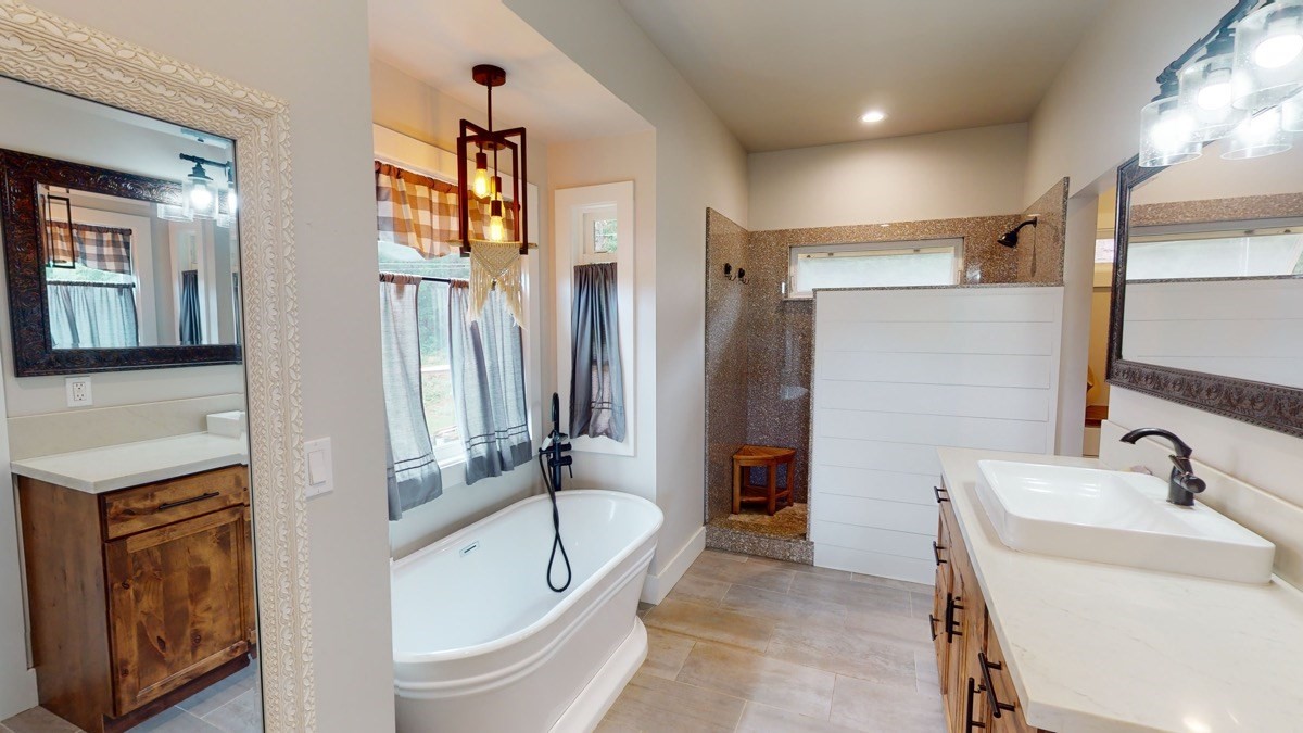 4592 A Awawa Road Hanapepe, HI 96705 - Photo 13 of 24 a bathroom with a tub sink and mirror