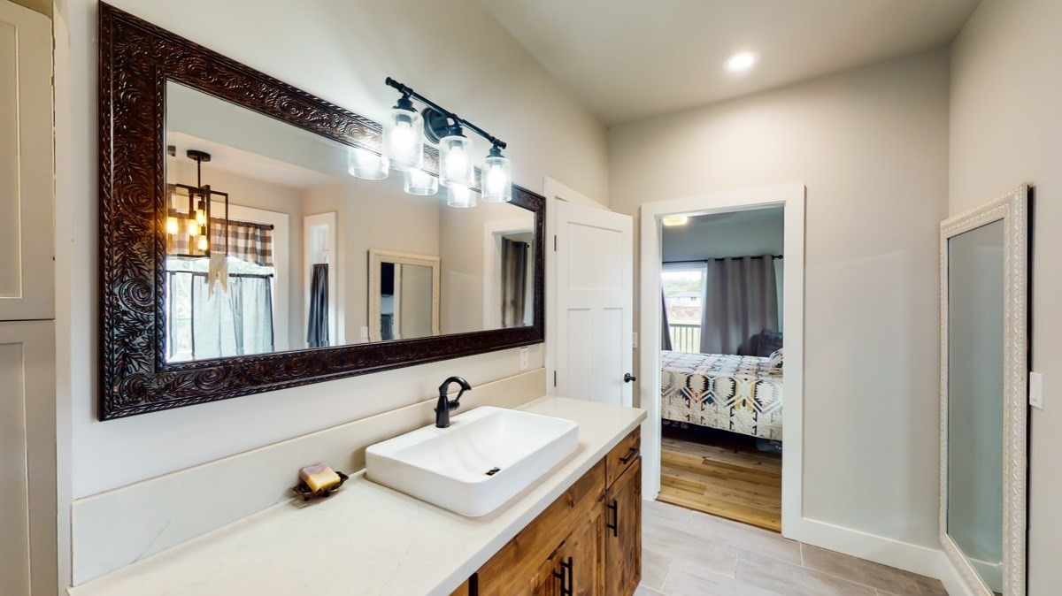 4592 A Awawa Road Hanapepe, HI 96705 - Photo 14 of 24 a en suite bathroom with a sink and a mirror