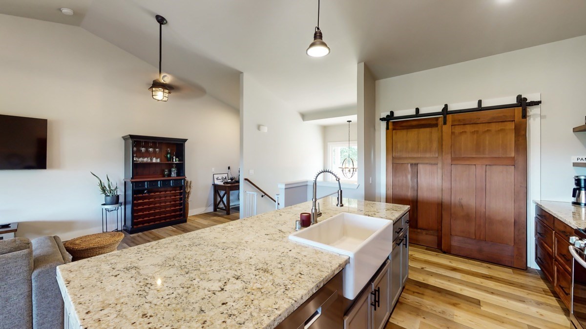 4592 A Awawa Road Hanapepe, HI 96705 - Photo 3 of 24 a en suite bathroom with a granite countertop sink and a mirror