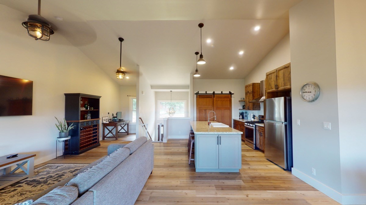 4592 A Awawa Road Hanapepe, HI 96705 - Photo 5 of 24 a living room with stainless steel appliances furniture a flat screen tv and kitchen view