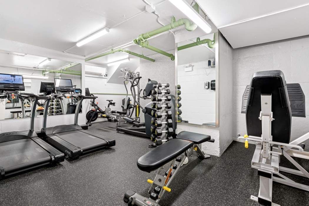 301 East 75th Street, Unit 19B Manhattan, NY 10021 - Photo 19 of 21 a room with gym equipment