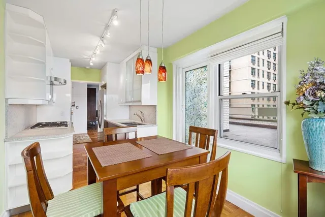 a view of a dining room with furniture window and outside view