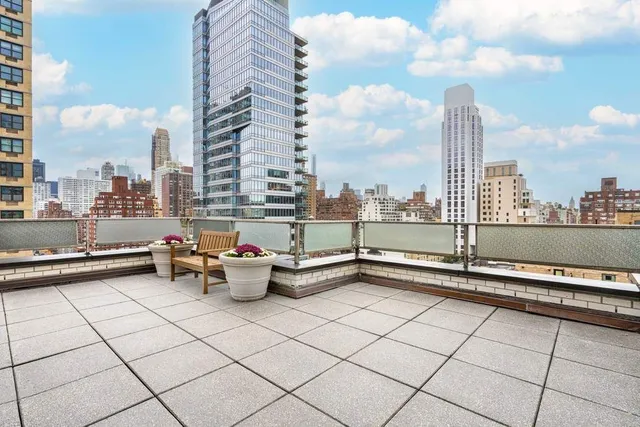 a view of roof with city view