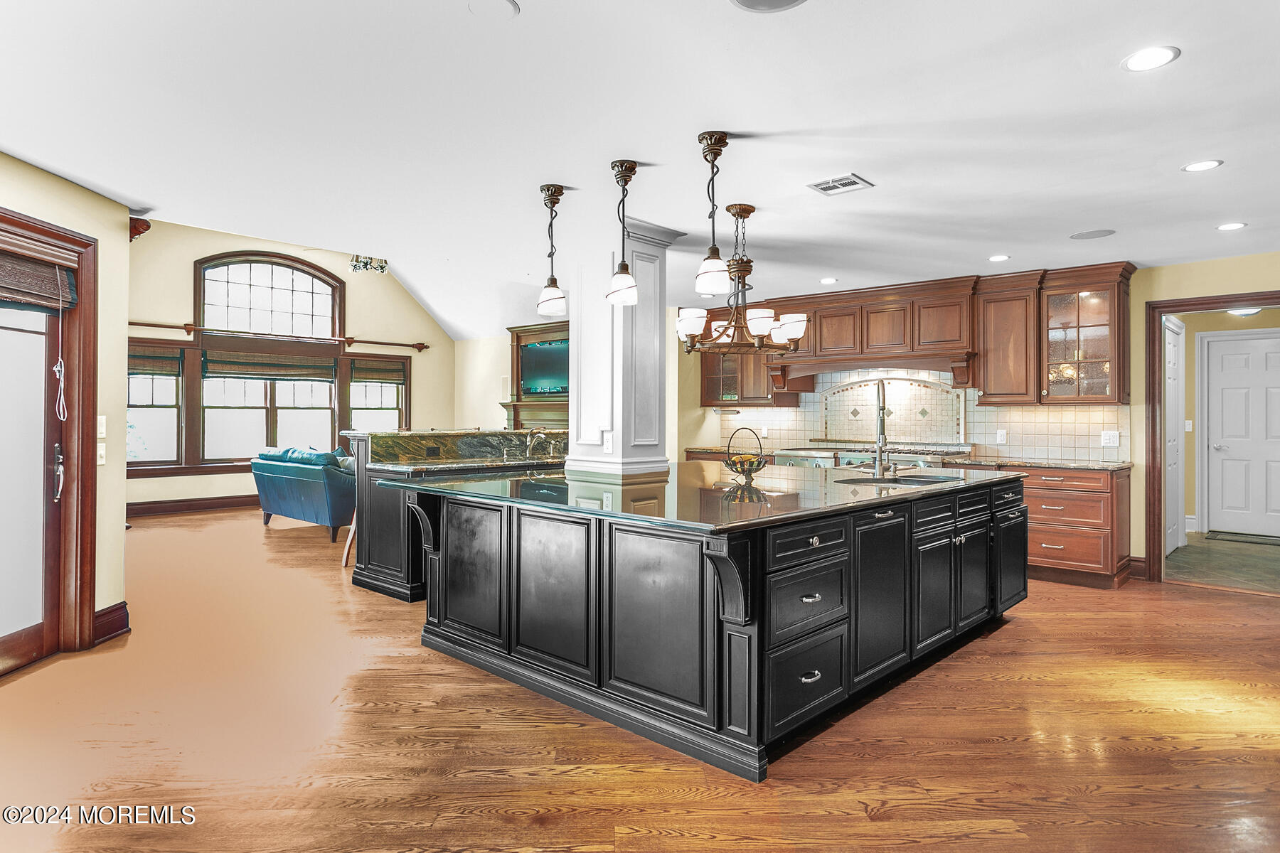 44 Meadowview Drive Colts Neck, NJ 07722 - Photo 11 of 68 a large kitchen with stainless steel appliances granite countertop a large counter top and a view of living room