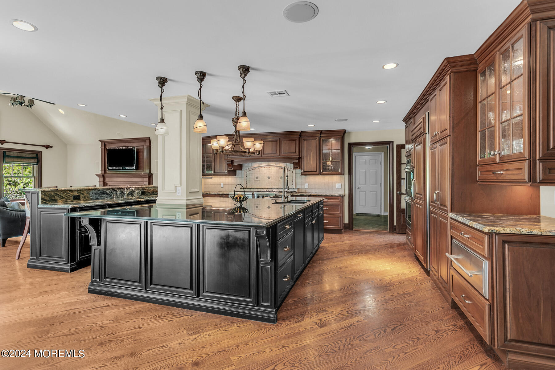 44 Meadowview Drive Colts Neck, NJ 07722 - Photo 12 of 68 a large kitchen with stainless steel appliances kitchen island granite countertop a stove a sink a refrigerator and a granite counter top