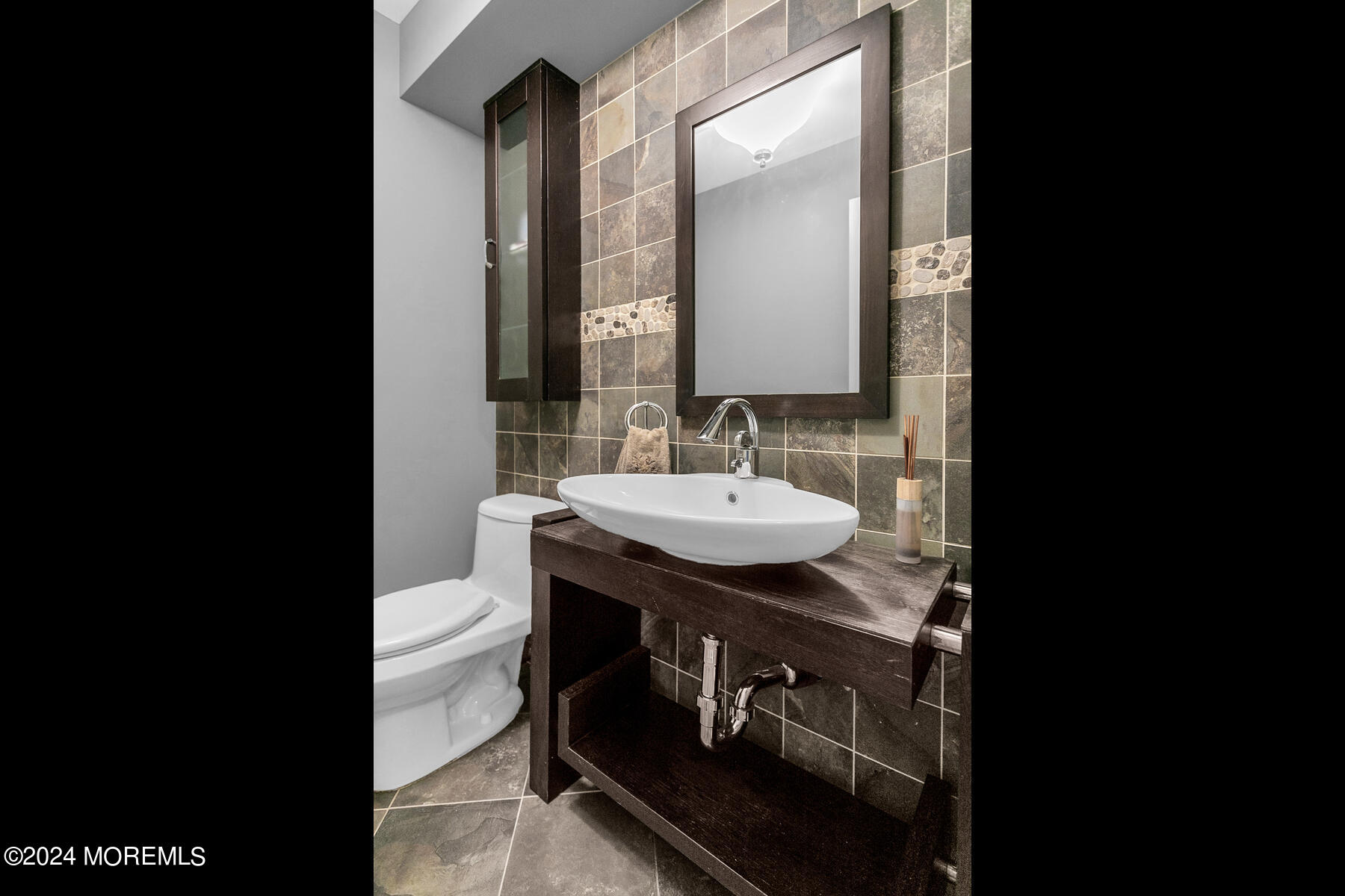 44 Meadowview Drive Colts Neck, NJ 07722 - Photo 25 of 68 a bathroom with a sink and a mirror