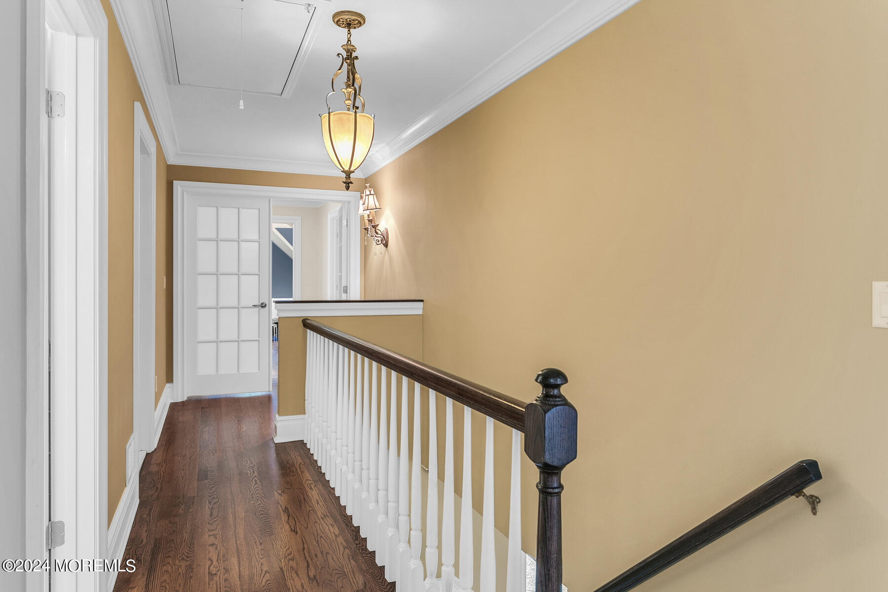 44 Meadowview Drive Colts Neck, NJ 07722 - Photo 26 of 68 a view of a hallway with wooden floor and chandelier