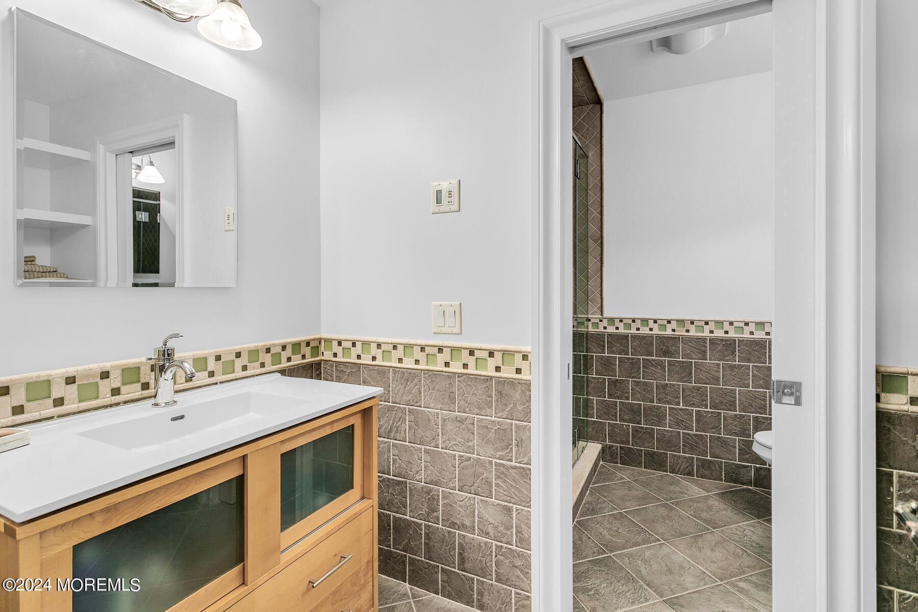 44 Meadowview Drive Colts Neck, NJ 07722 - Photo 30 of 68 a bathroom with a sink and a mirror