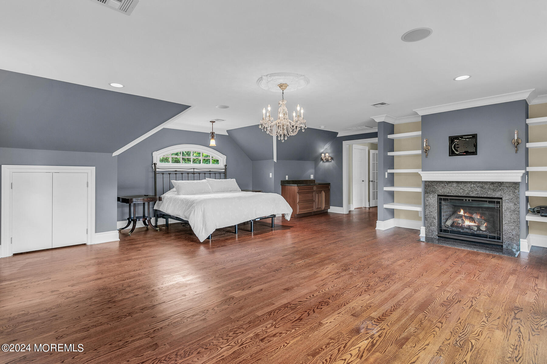 44 Meadowview Drive Colts Neck, NJ 07722 - Photo 32 of 68 a living room with furniture and a fireplace