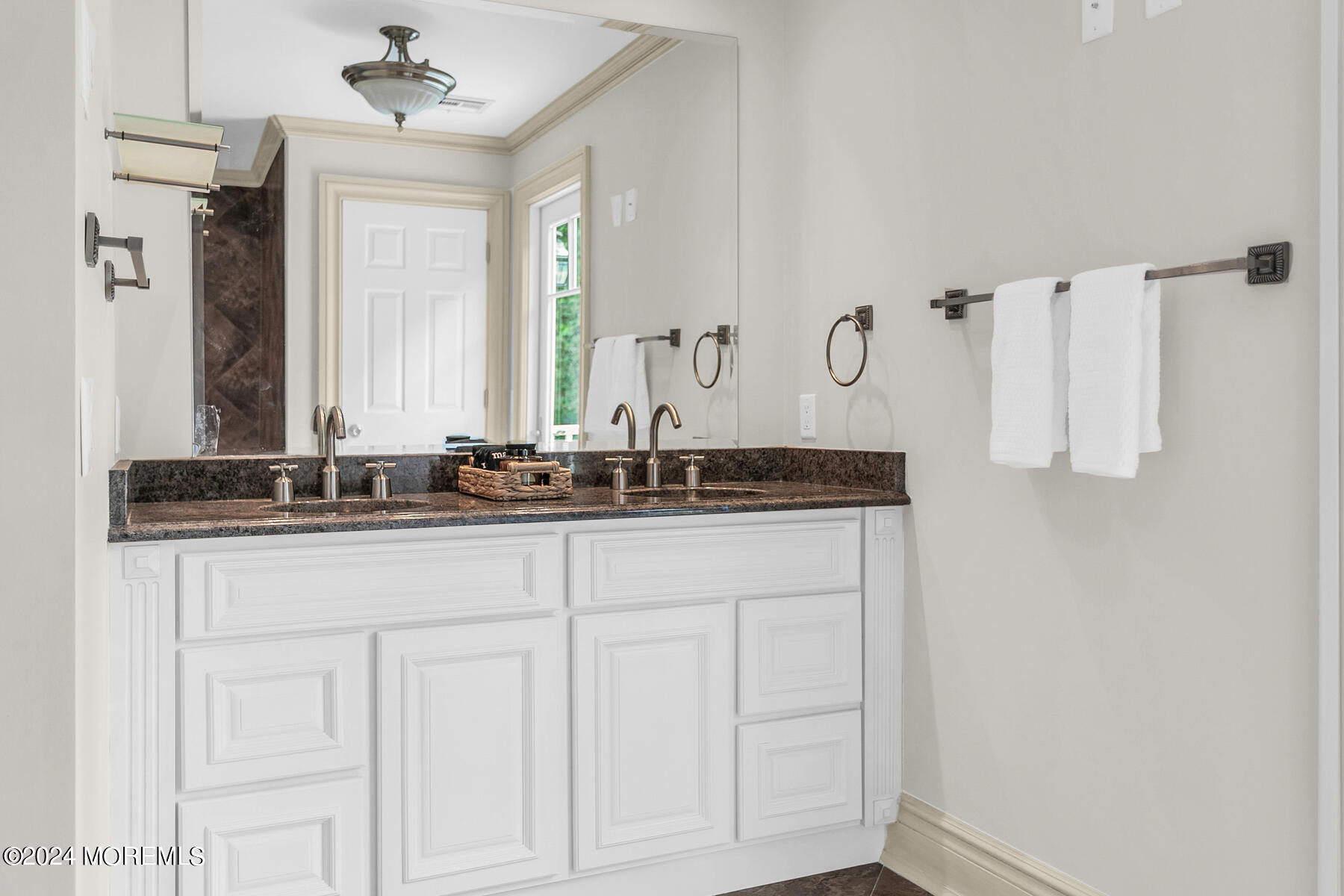 44 Meadowview Drive Colts Neck, NJ 07722 - Photo 38 of 68 a bathroom with a sink and a mirror
