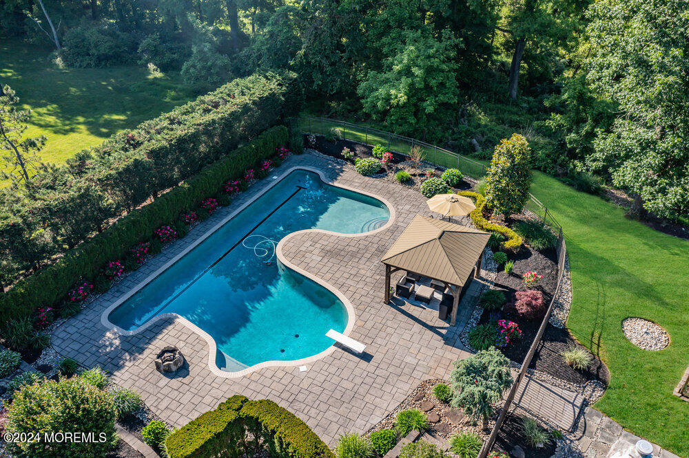 44 Meadowview Drive Colts Neck, NJ 07722 - Photo 4 of 68 an aerial view of a house with swimming pool garden and mountain view in back