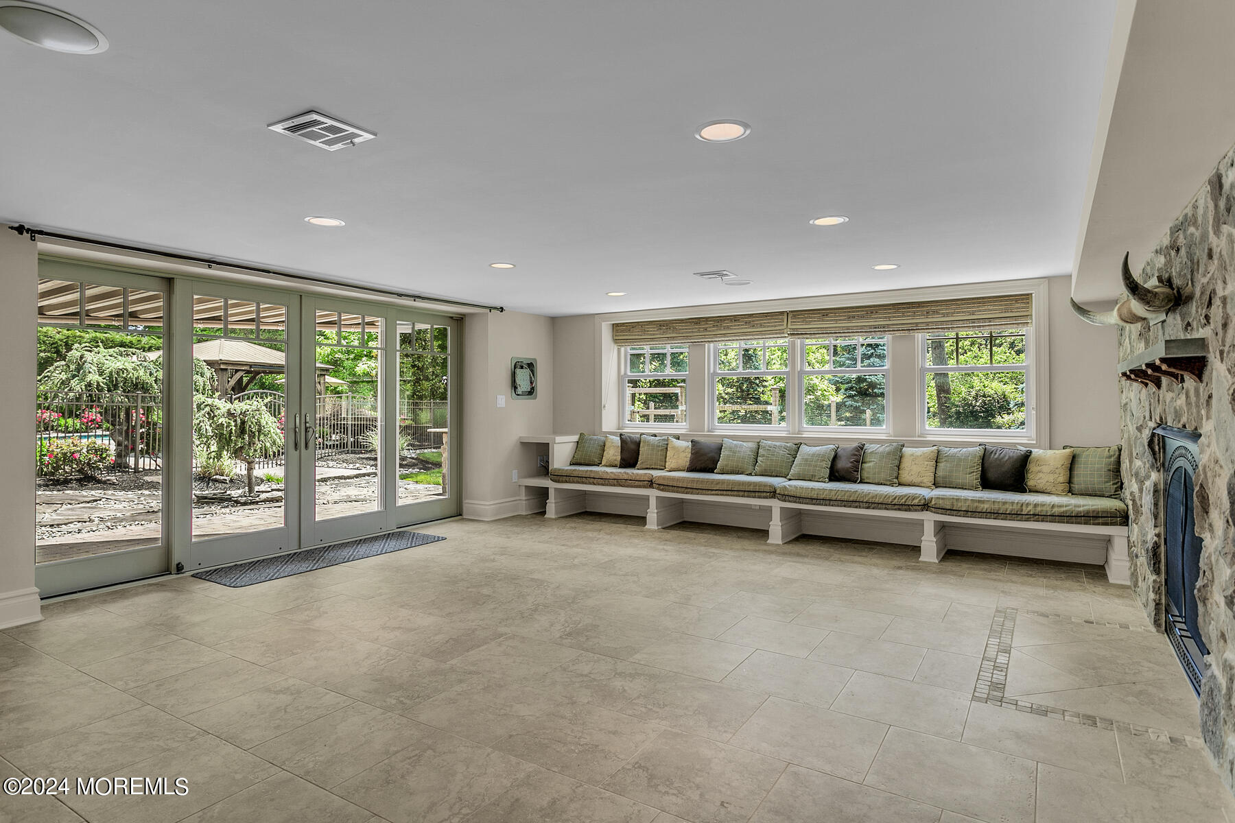 44 Meadowview Drive Colts Neck, NJ 07722 - Photo 41 of 68 a living room with furniture and a floor to ceiling window
