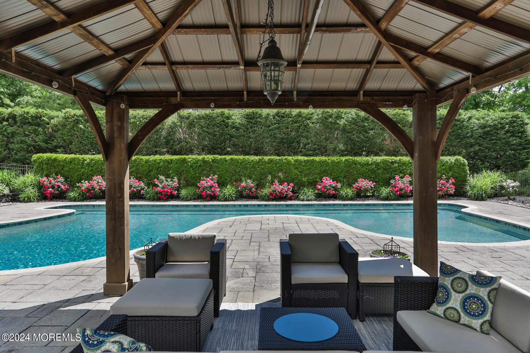 44 Meadowview Drive Colts Neck, NJ 07722 - Photo 50 of 68 a view of a patio with couches table chairs and potted plants