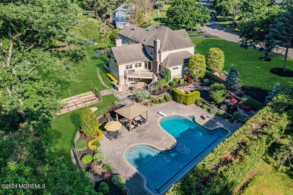 44 Meadowview Drive Colts Neck, NJ 07722 - Photo 6 of 68 an aerial view of a house with a swimming pool a yard and a garden