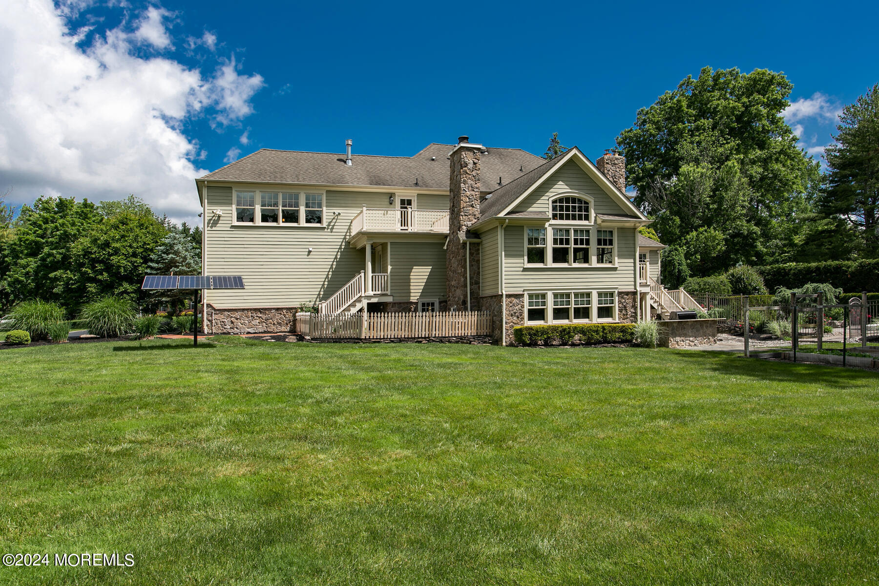 44 Meadowview Drive Colts Neck, NJ 07722 - Photo 62 of 68 a view of a house with a big yard and potted plants